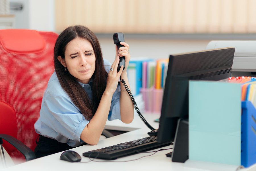 Scared Employee Answering A Phone Call From Her Angry Boss